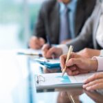 Business owners looking at proposals