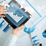 Person checking tablet for reports