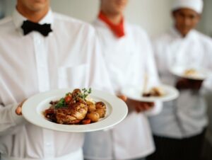 Restaurant server holding plates of food.