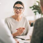 Business owner meeting with employees
