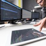 Businessperson using software to analyze data