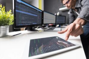 Businessperson using software to analyze data
